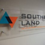Southern Land, signage to 3-D acrylic wall panel 